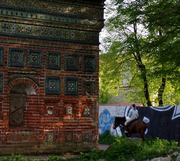 Horse-riding in the courtyard of an abandoned :( church