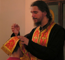 Vladimir 
У име Оца и Сина и Светога Духа // In the name of the Father and the Son... 
2006-06-25 20:23:03