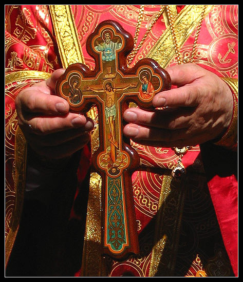 cross in bishop jeremy's hands