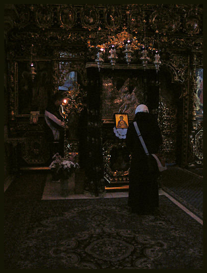 Prayer in front of Wonderworking icon of Mother of God at Monastery Putna