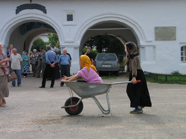 children playing in front of one of Pskov monasteries