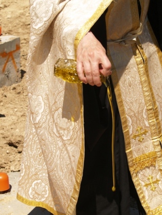Holy Oil being pour during Foundation Blessing