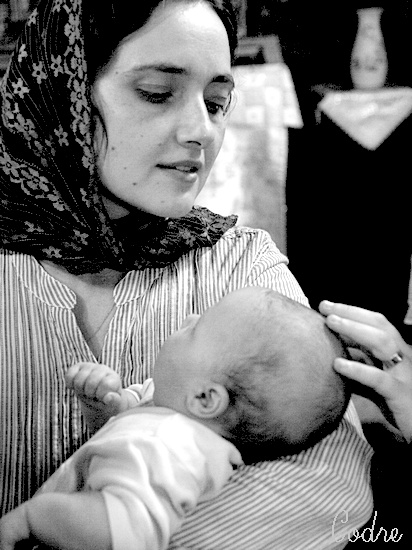 at baptize - Child with godmother and mother hand