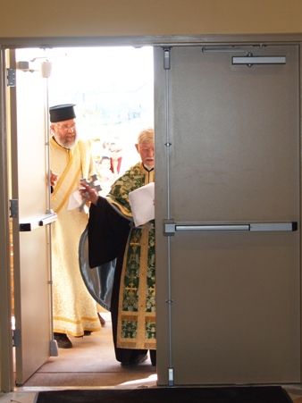 Opening the newly blessed doors of St Luke Church.  The church is now opened for the first time