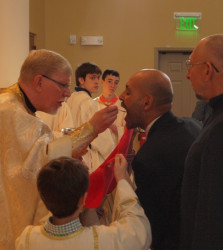 angus 
The Newly Chrismated, takes his first communion 
2011-03-13 01:19:08
