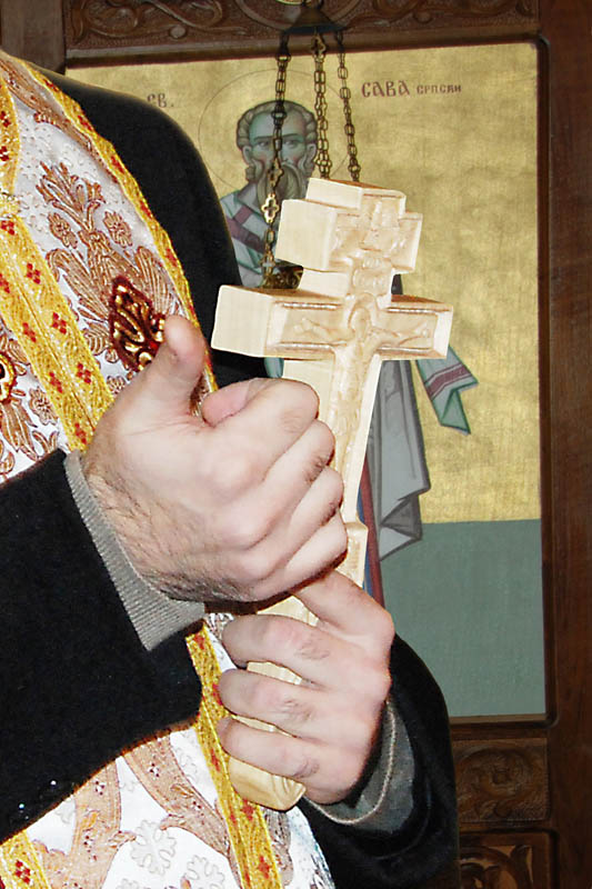 The cross in the hands of a priest