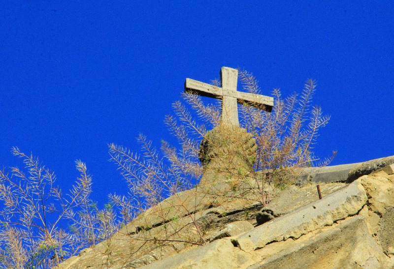 Cross over the gate of Orthodox monastery in Nikozi
