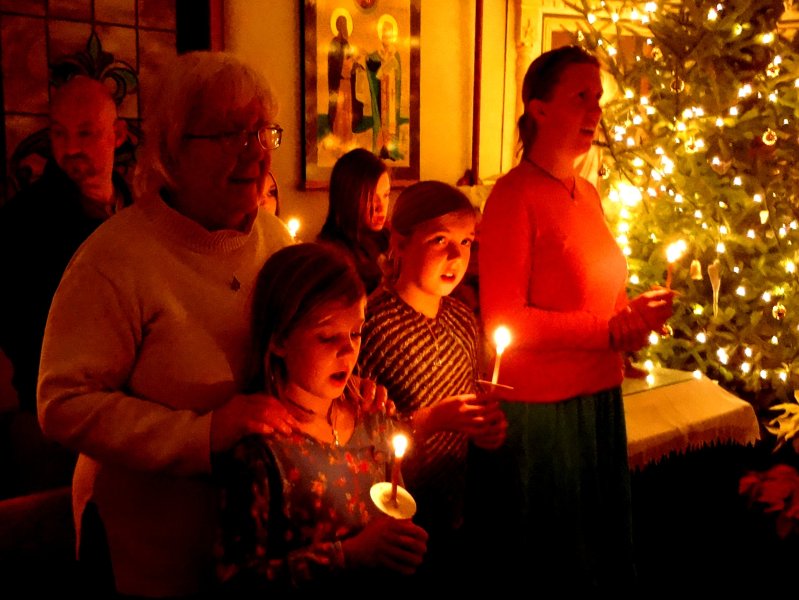 Singing carols after the Christmas night liturgy
