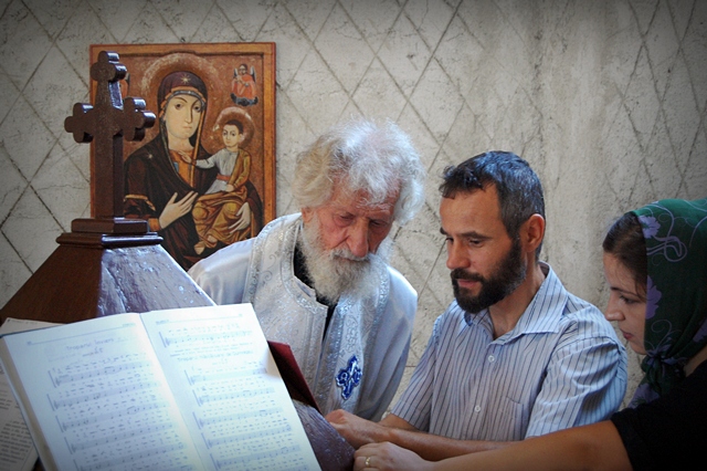 Father Petru Darascu and singers