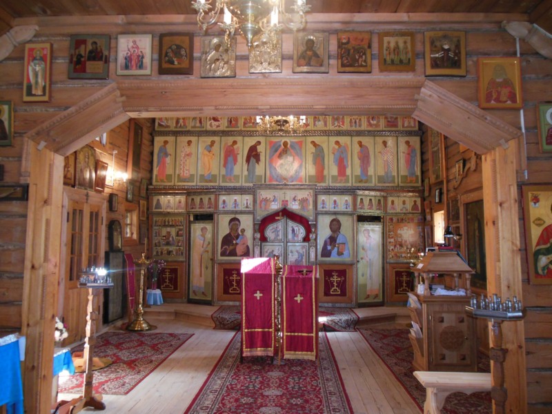 Iconostas of small wooden church in Butovo