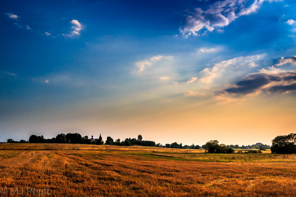 Summer evening over church in Losinka, Poland