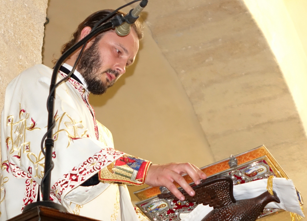 Reading the Gospel in the church of Mother of God "Gonia" in Kolymbari