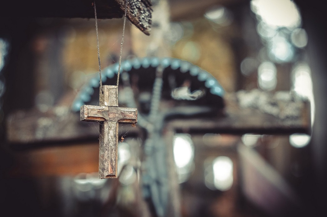 Cross with spiderweb