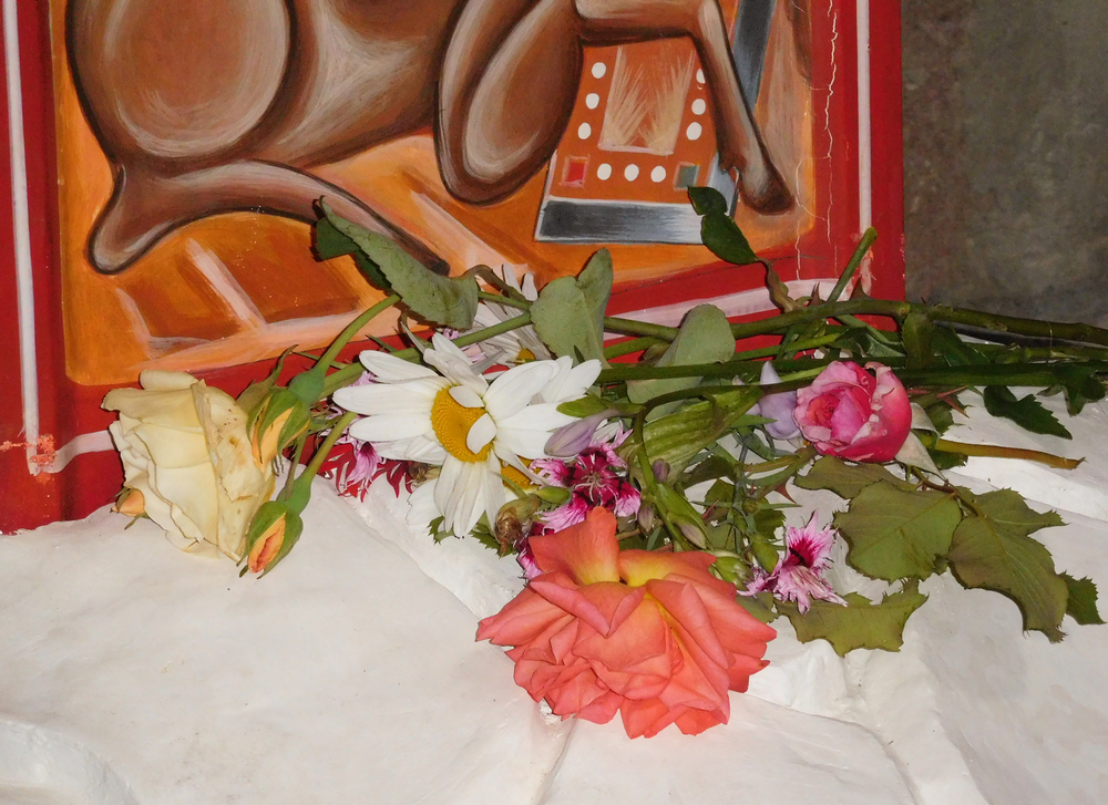 Flowers for Christ. Under the Crucifix...