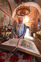 jarek 
Archim. John of St. Theodore Tyron Monastery in Pravec showing an old Gospel 
2017-08-28 17:52:17
