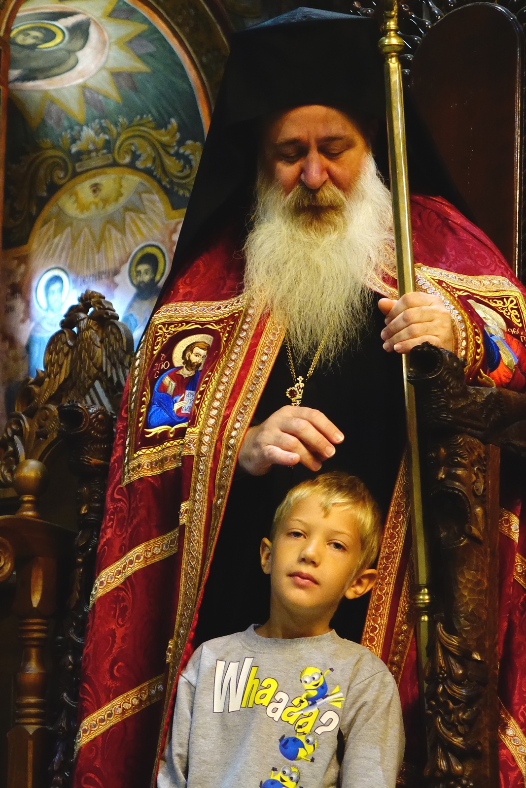 Bishop Sionij blessing a child