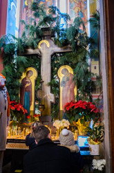 Vlutes 
Father and daughters light candles before Liturgy 
2018-01-15 17:06:17