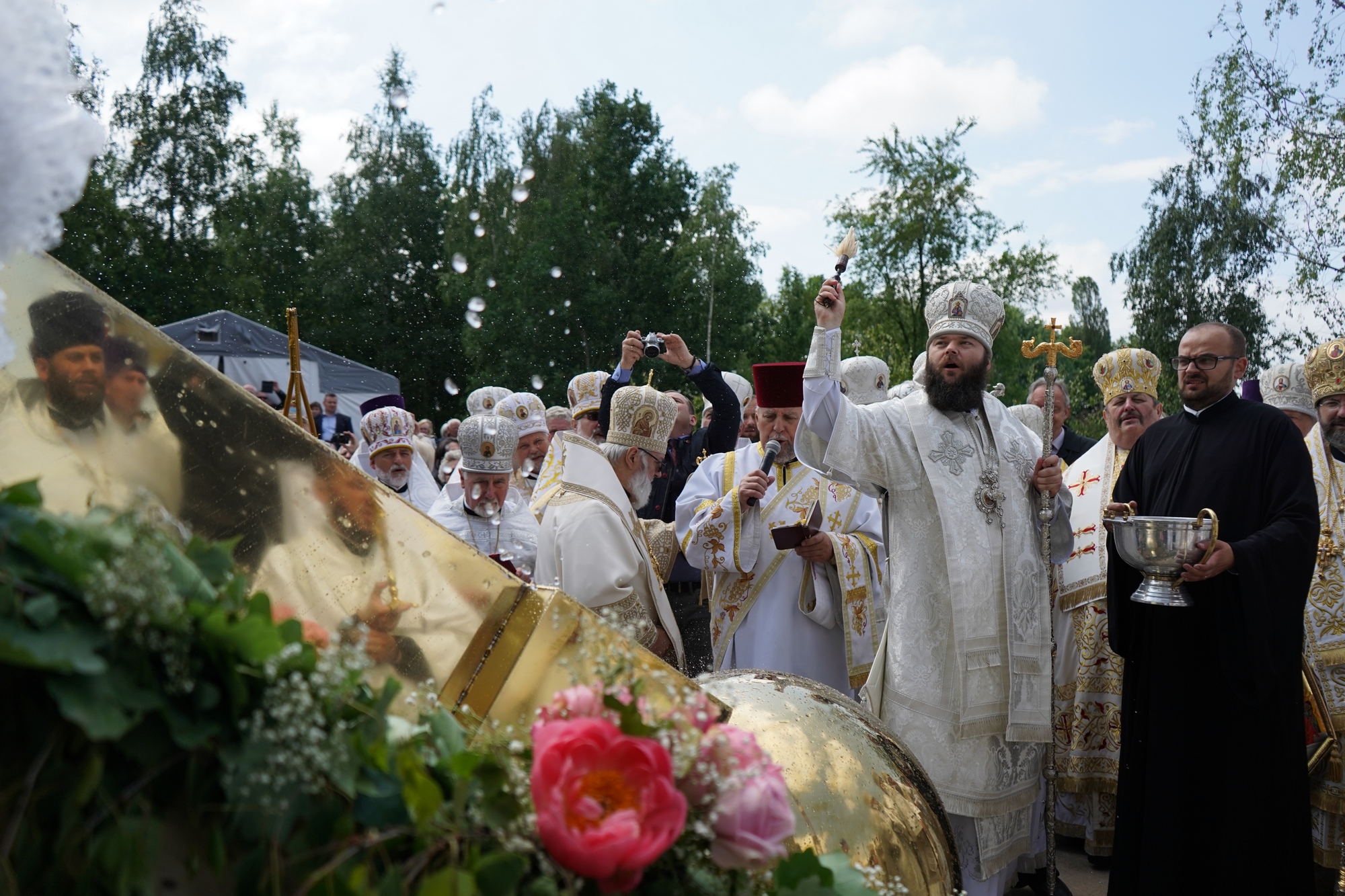 Blessing and elevation of main cross on the roof of Hagia Sophia Orthodox church in Warsaw