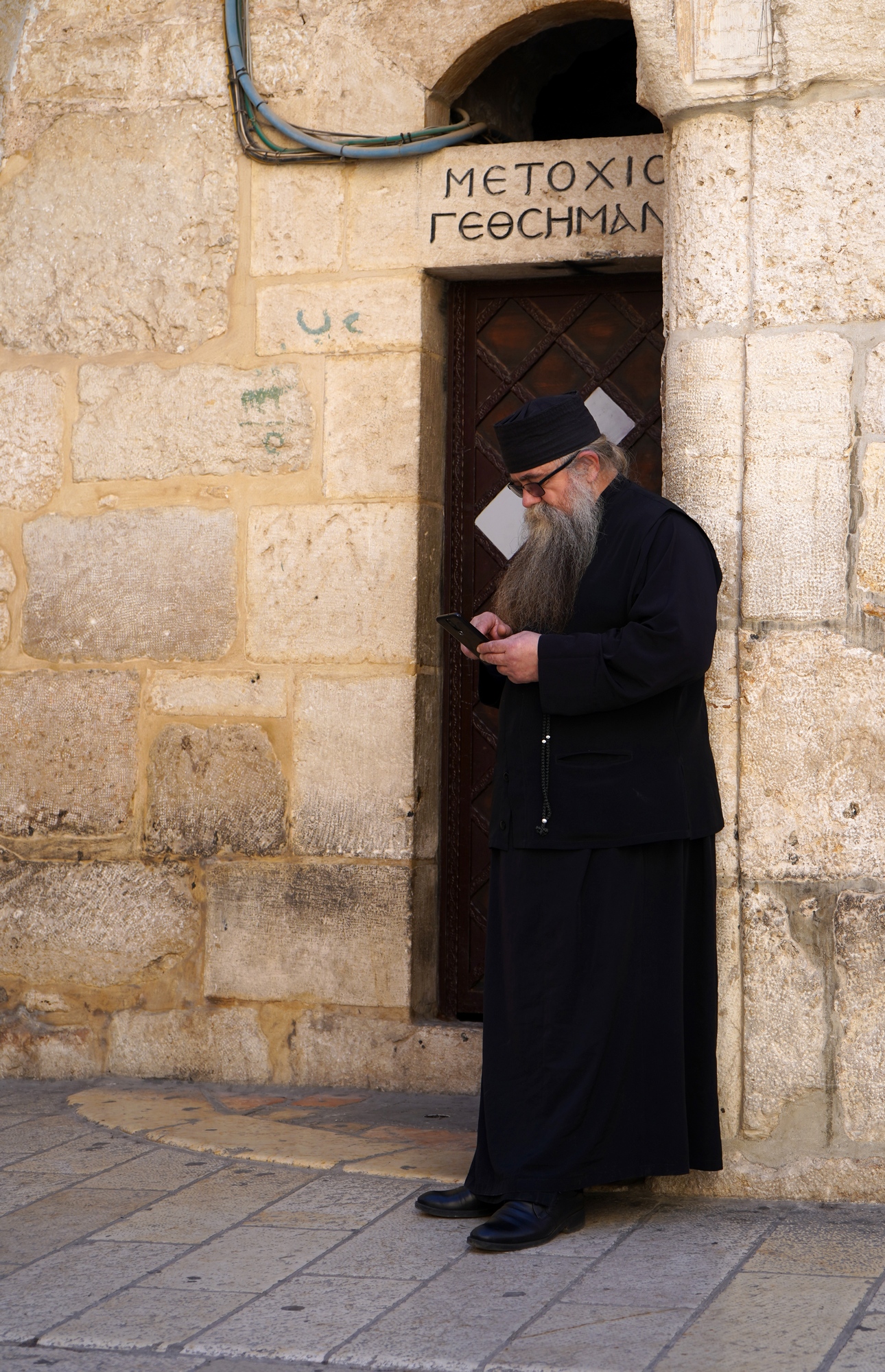 Jerusalem. The entrence to Dormition Greek Orthodox Metochion. A priest