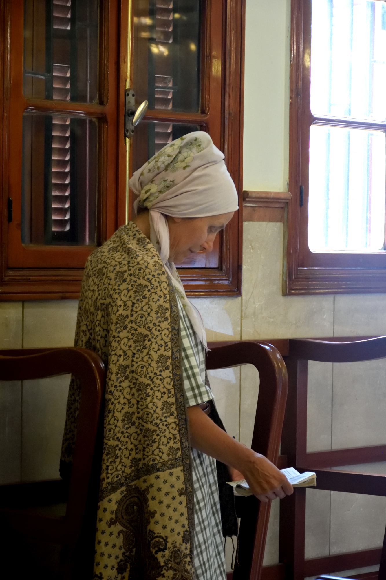 A Russian woman praying in st. John church in Beirut