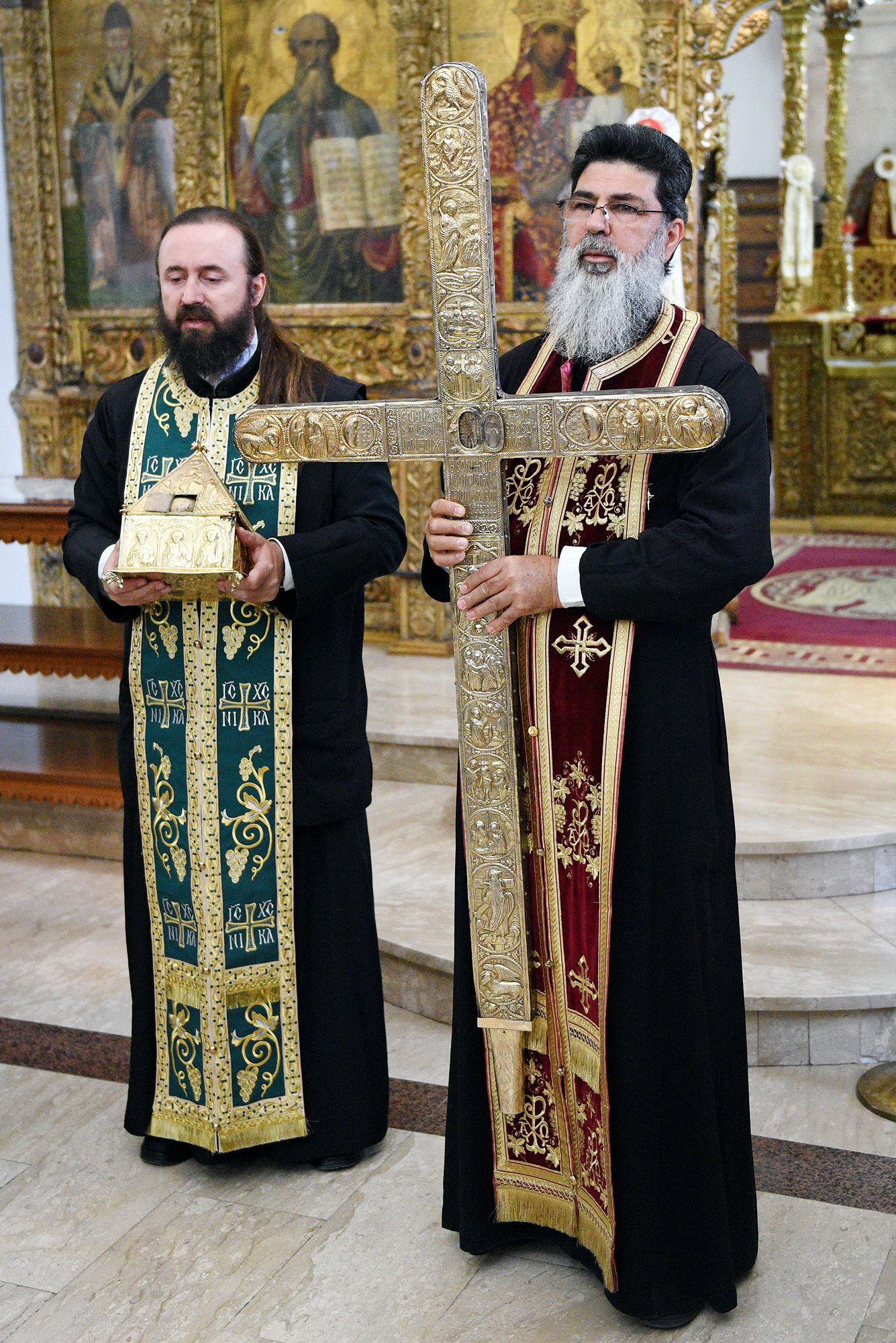 Fr Neophytos from Omodos holding piece of Holy Cross and rope