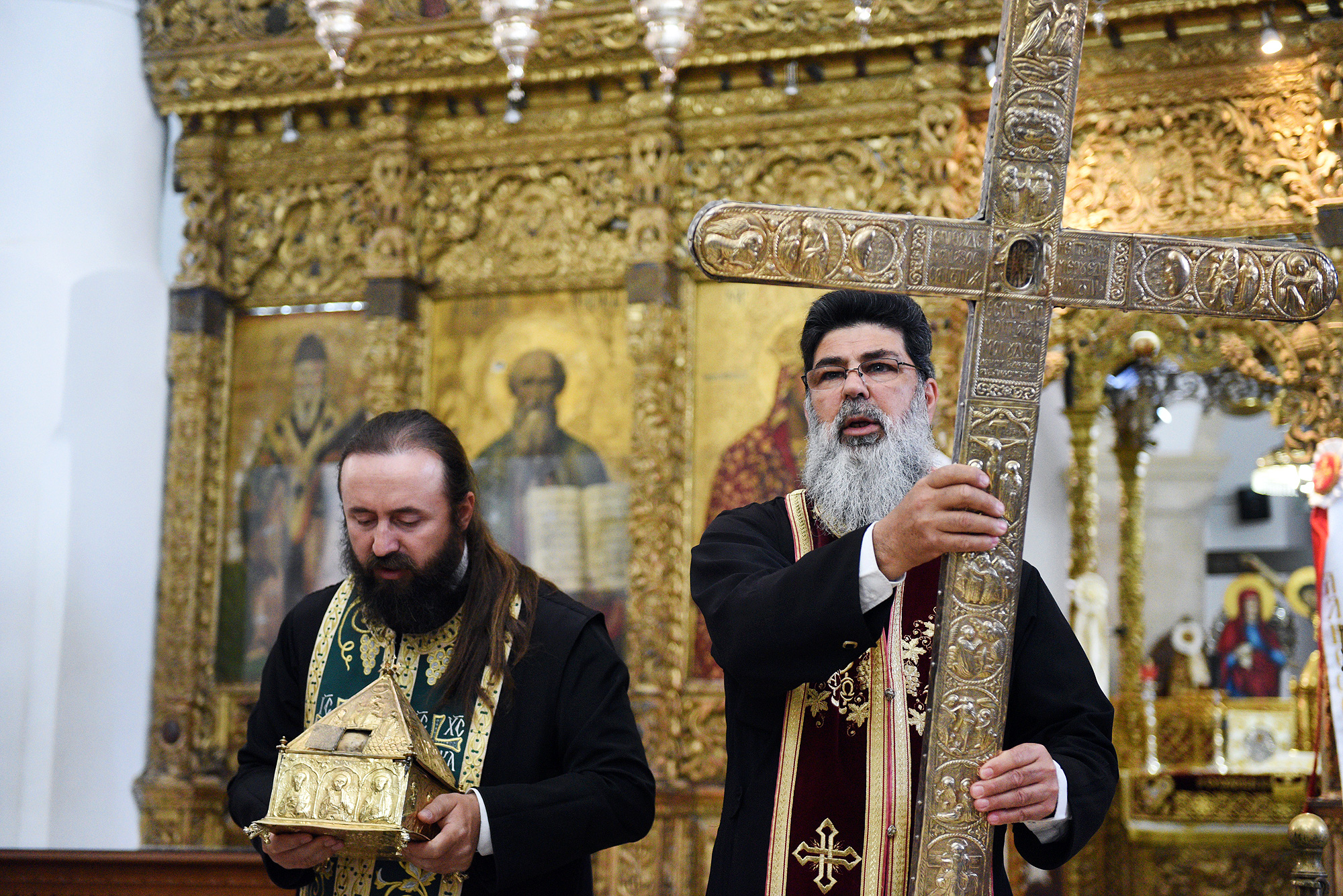 Fr Neophytos from Omodos holding piece of Holy Cross and rope
