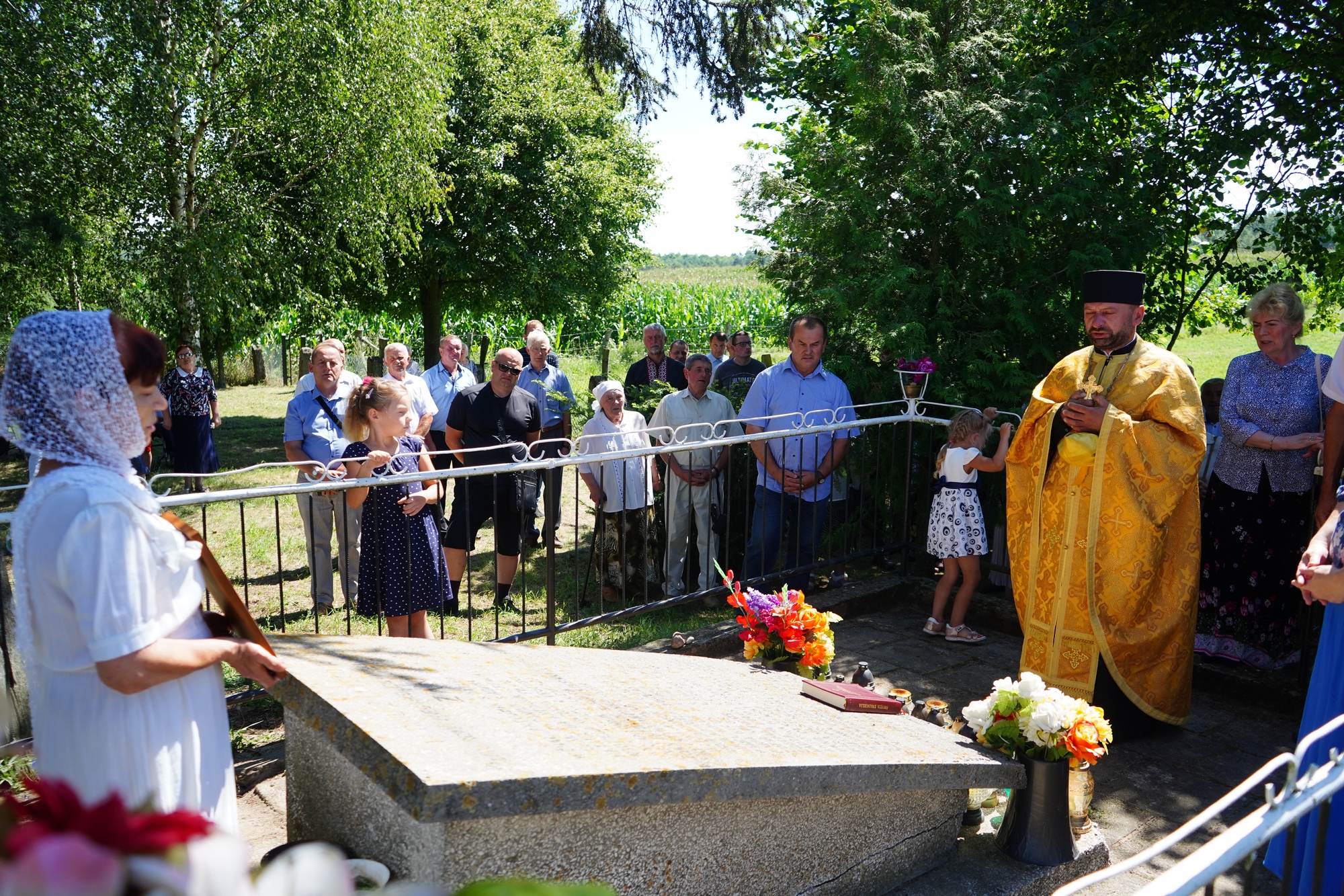 The prayer at Podlasie Martyrs grave close to Zanie village