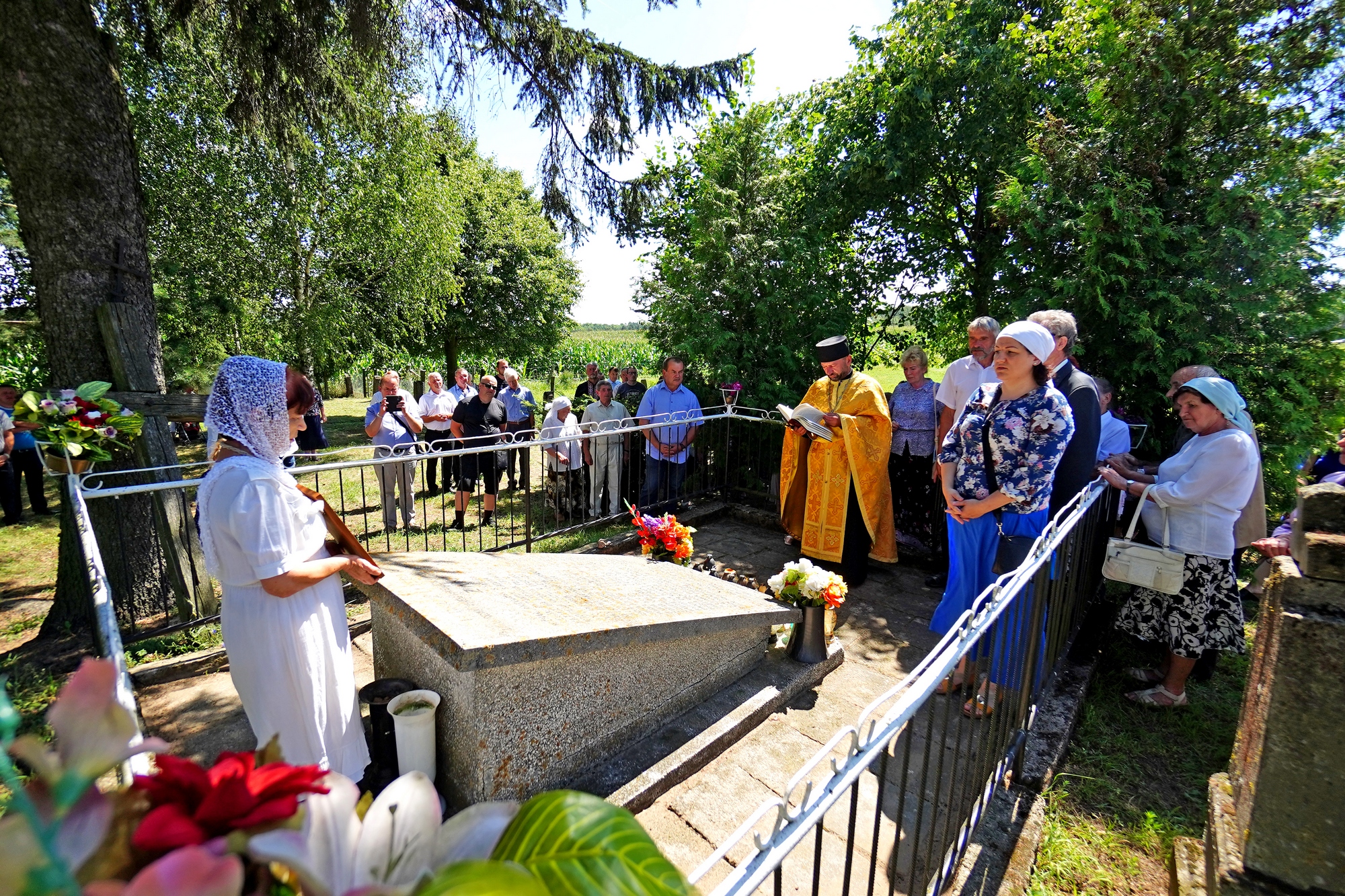 The prayer at Podlasie Martyrs grave close to Zanie village