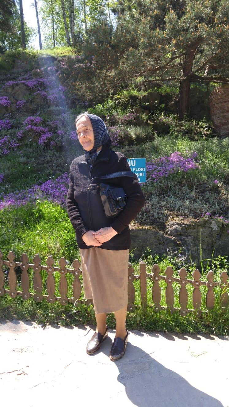Grandmother shining like an angel at Arsenie Boca&#039s grave