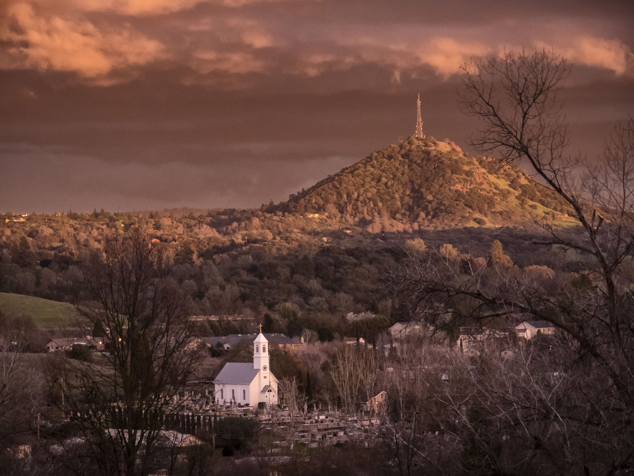 An afternoon winter storm passes St. Sava Church  in Jackson, Calif.