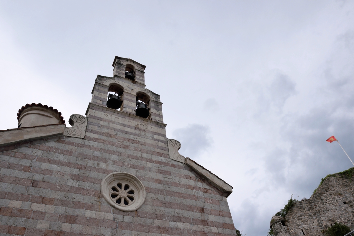 An Orthodox church and Montenegrin flag, Budva 2024