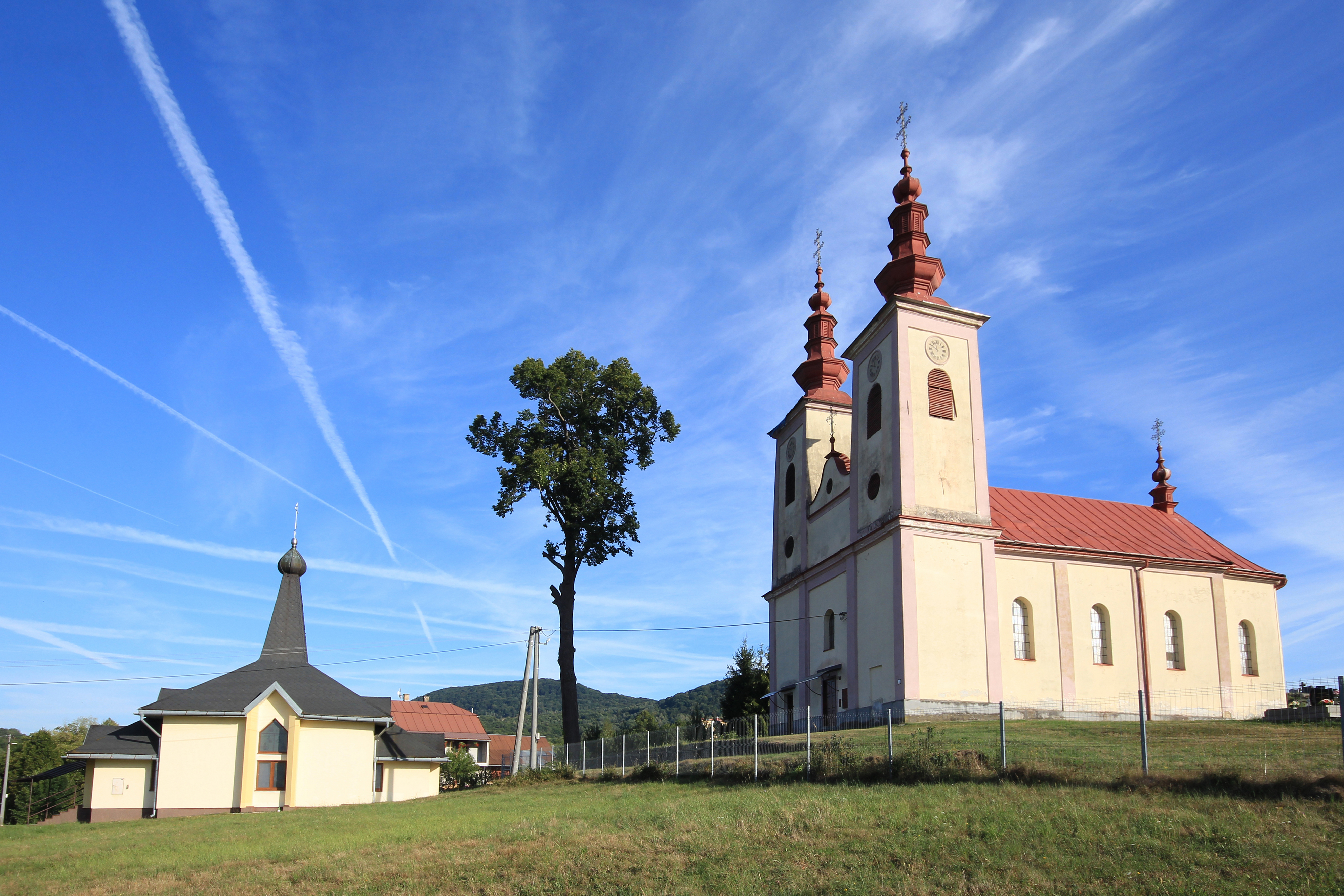 The old (on right) and new (on left) Orthodox church of the Nativity of the Mother of God in Dubová